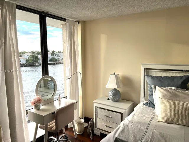 a bathroom with a tub sink and a window