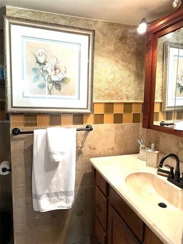 a bathroom with a toilet and a shower curtain