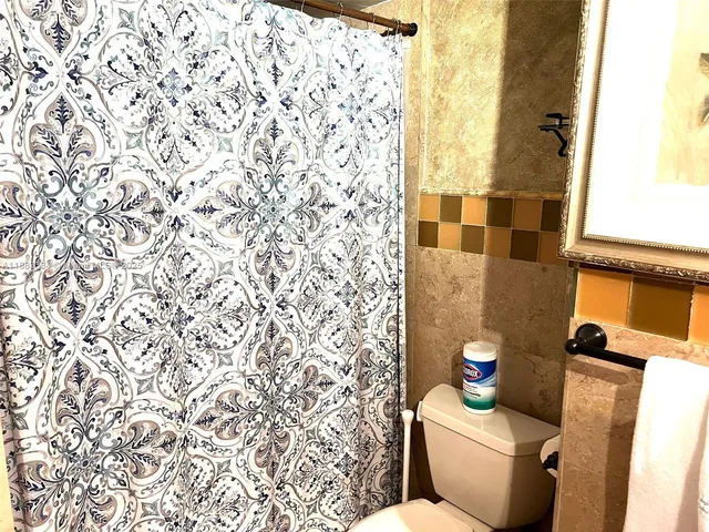 a bathroom with a sink vanity and a mirror