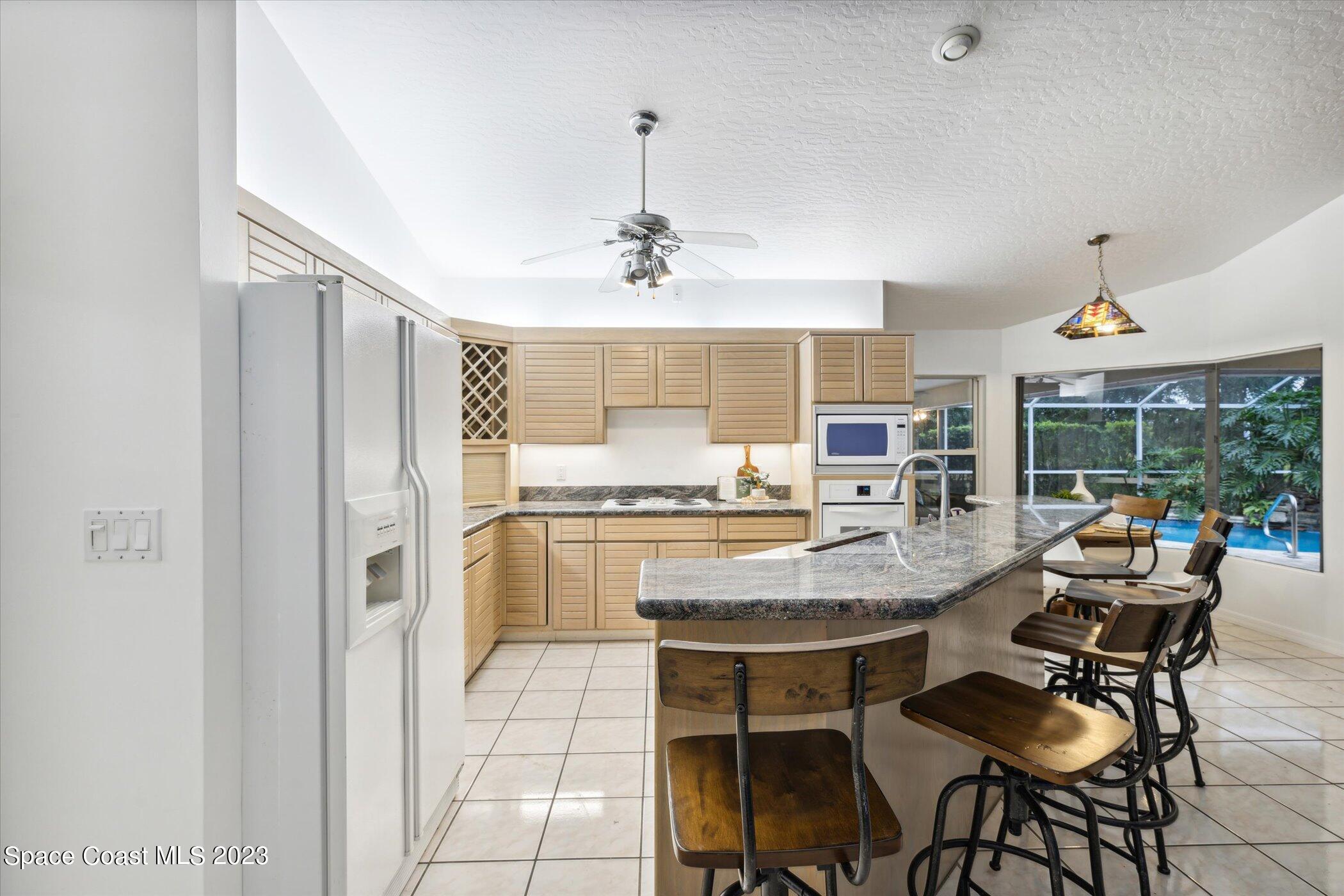 4644 Canard Road Melbourne, FL 32934 - Photo 13 of 42 a view of a dining room with furniture window and outside view