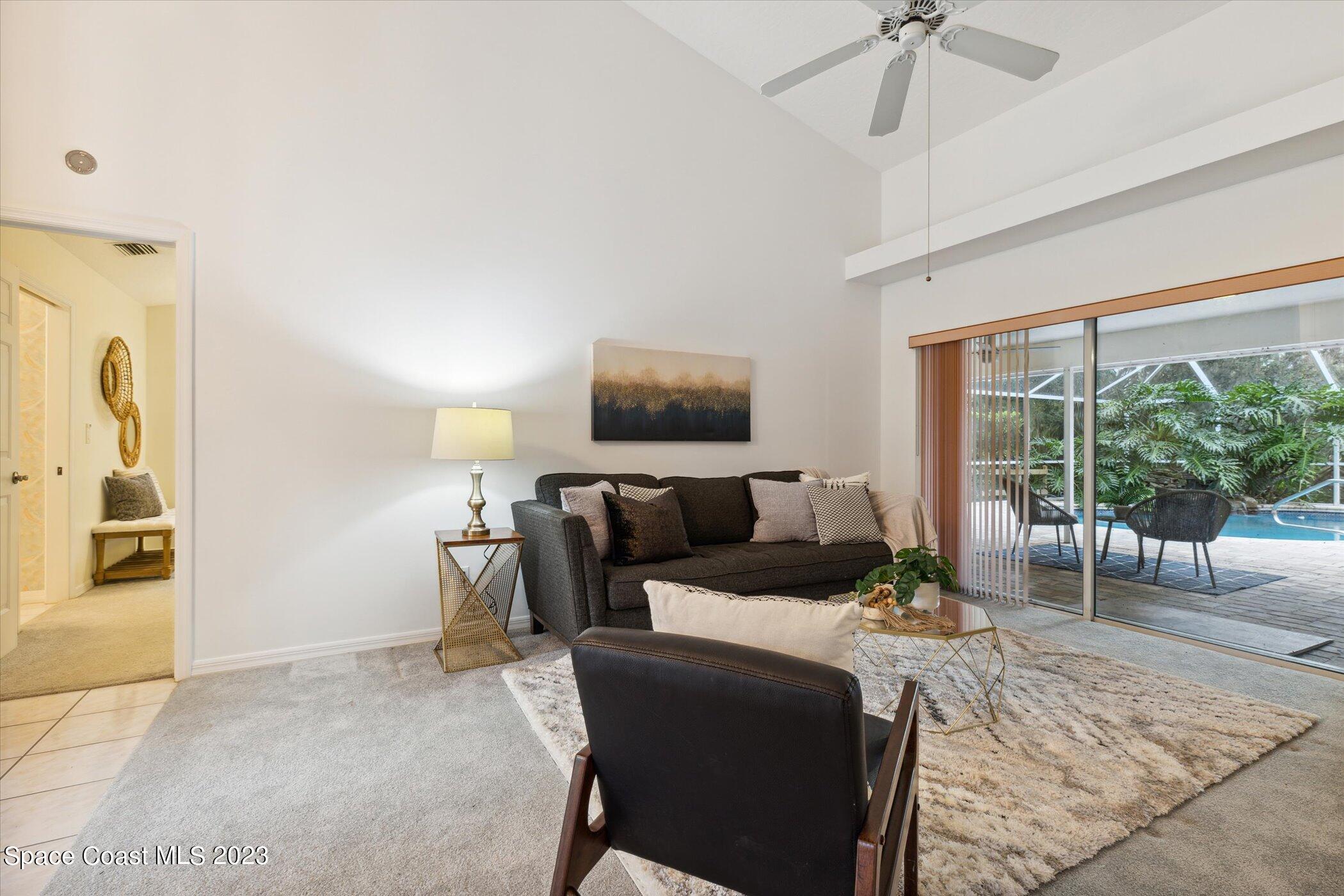 4644 Canard Road Melbourne, FL 32934 - Photo 17 of 42 a living room with furniture and a flat screen tv