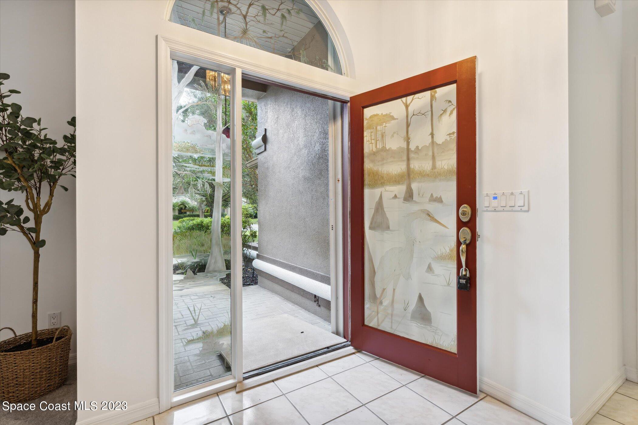 4644 Canard Road Melbourne, FL 32934 - Photo 31 of 42 a view of a bathroom with a glass door and glass door