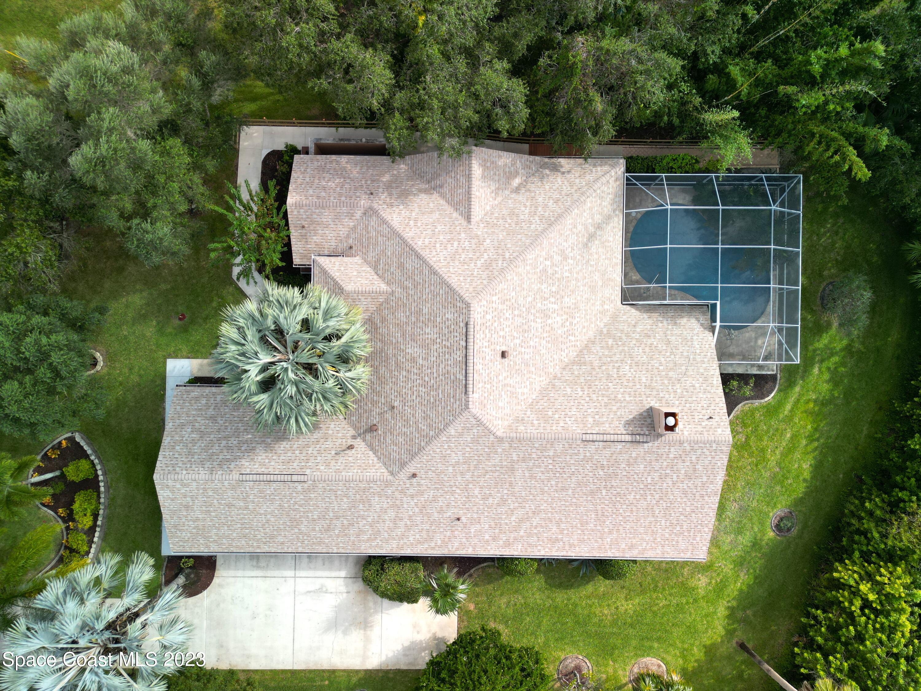 4644 Canard Road Melbourne, FL 32934 - Photo 37 of 42 an aerial view of a house with a yard