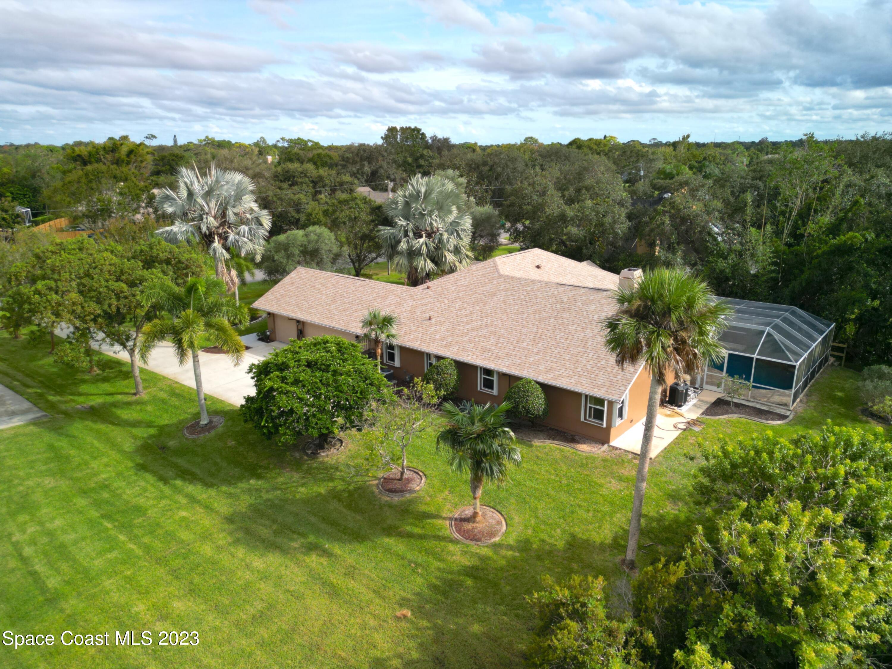 4644 Canard Road Melbourne, FL 32934 - Photo 38 of 42 an aerial view of a house with a garden