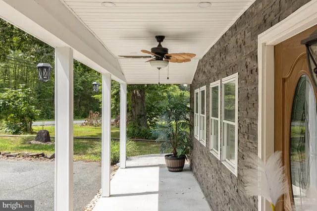 a view of a refrigerator in kitchen and a glass window