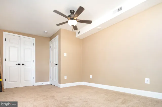 a front view of house with yard and trees