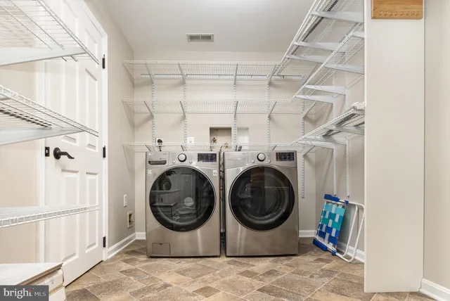 a front view of a house with outdoor seating