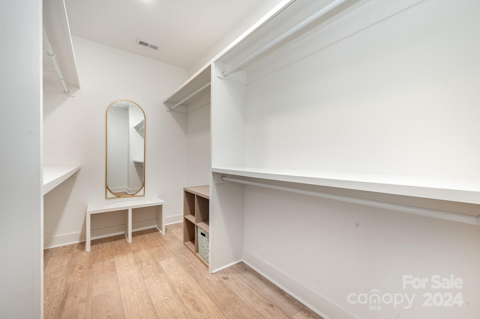 643 Tennyson Drive Charlotte, NC 28208 - Photo 11 of 42 a view of an empty room with wooden floor and a window