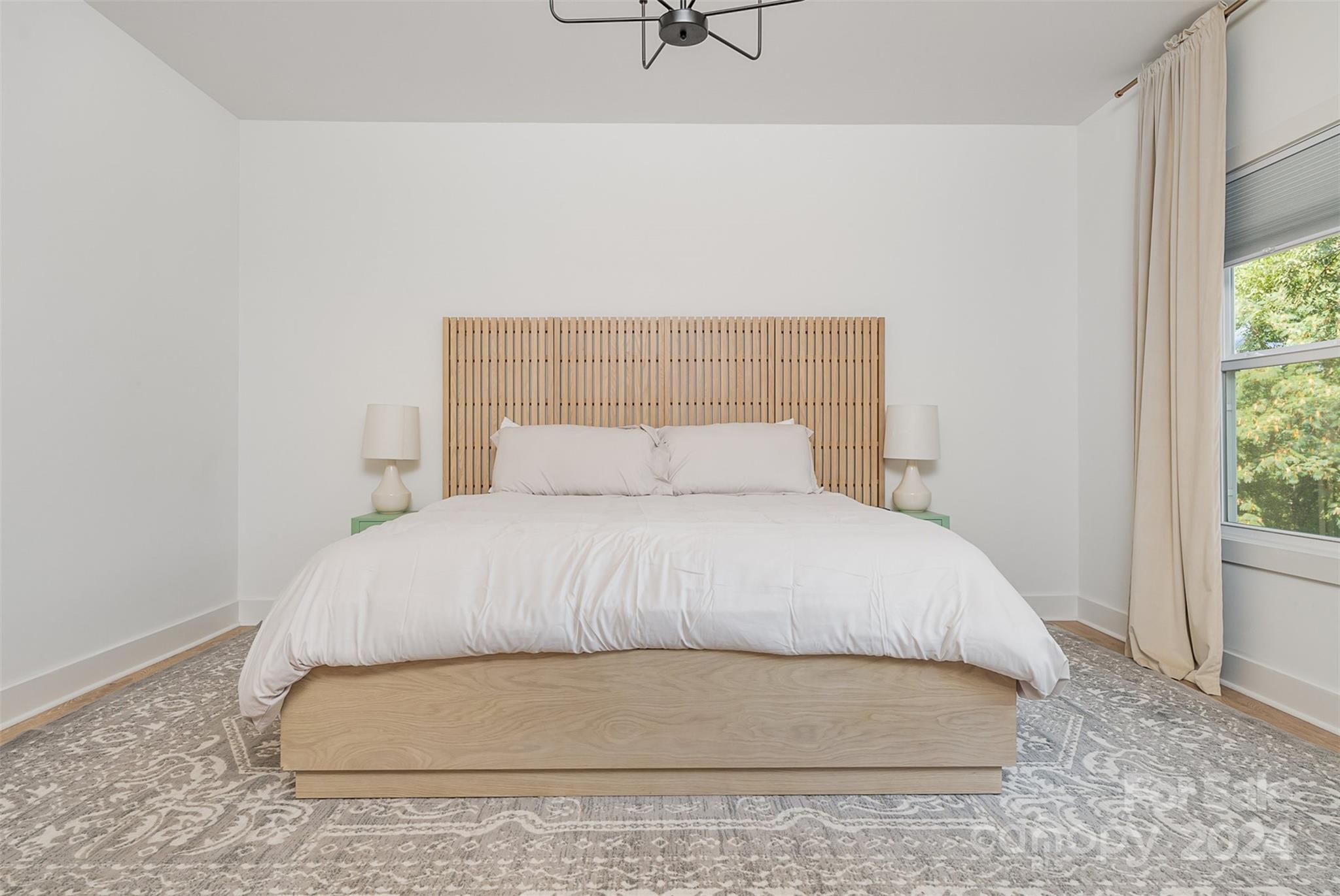 643 Tennyson Drive Charlotte, NC 28208 - Photo 13 of 42 a bedroom with a bed and window