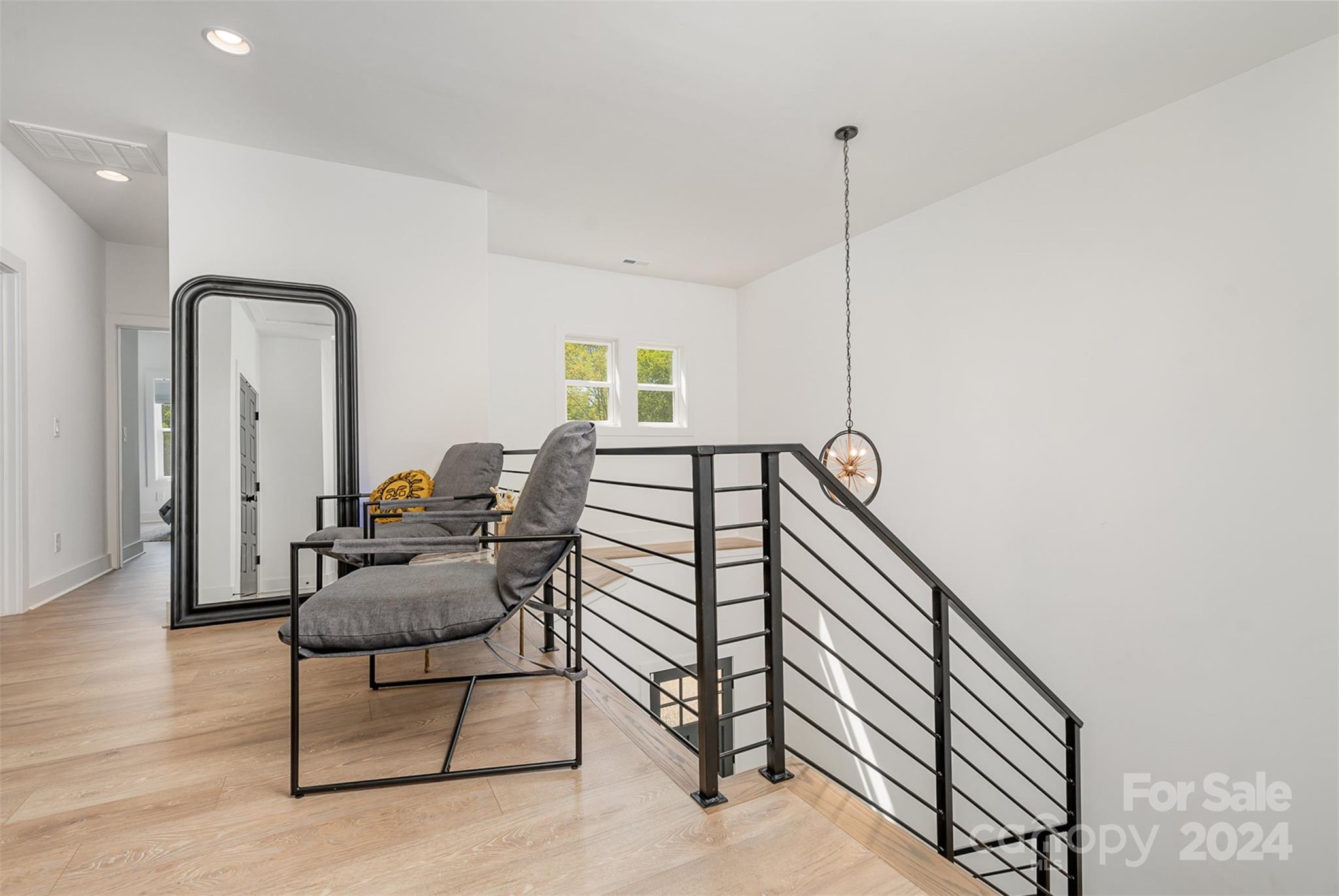 643 Tennyson Drive Charlotte, NC 28208 - Photo 16 of 42 a living room with furniture and a floor to ceiling window