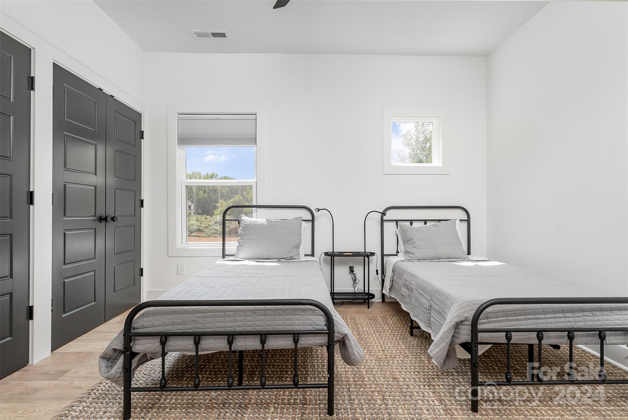 643 Tennyson Drive Charlotte, NC 28208 - Photo 20 of 42 a bedroom with two beds and a table