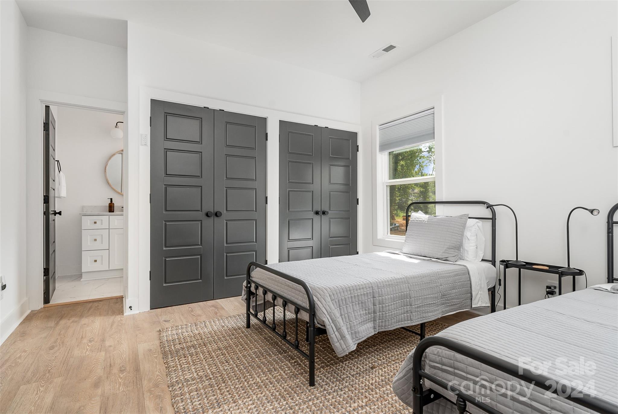 643 Tennyson Drive Charlotte, NC 28208 - Photo 21 of 42 a bedroom with two beds and painted walls