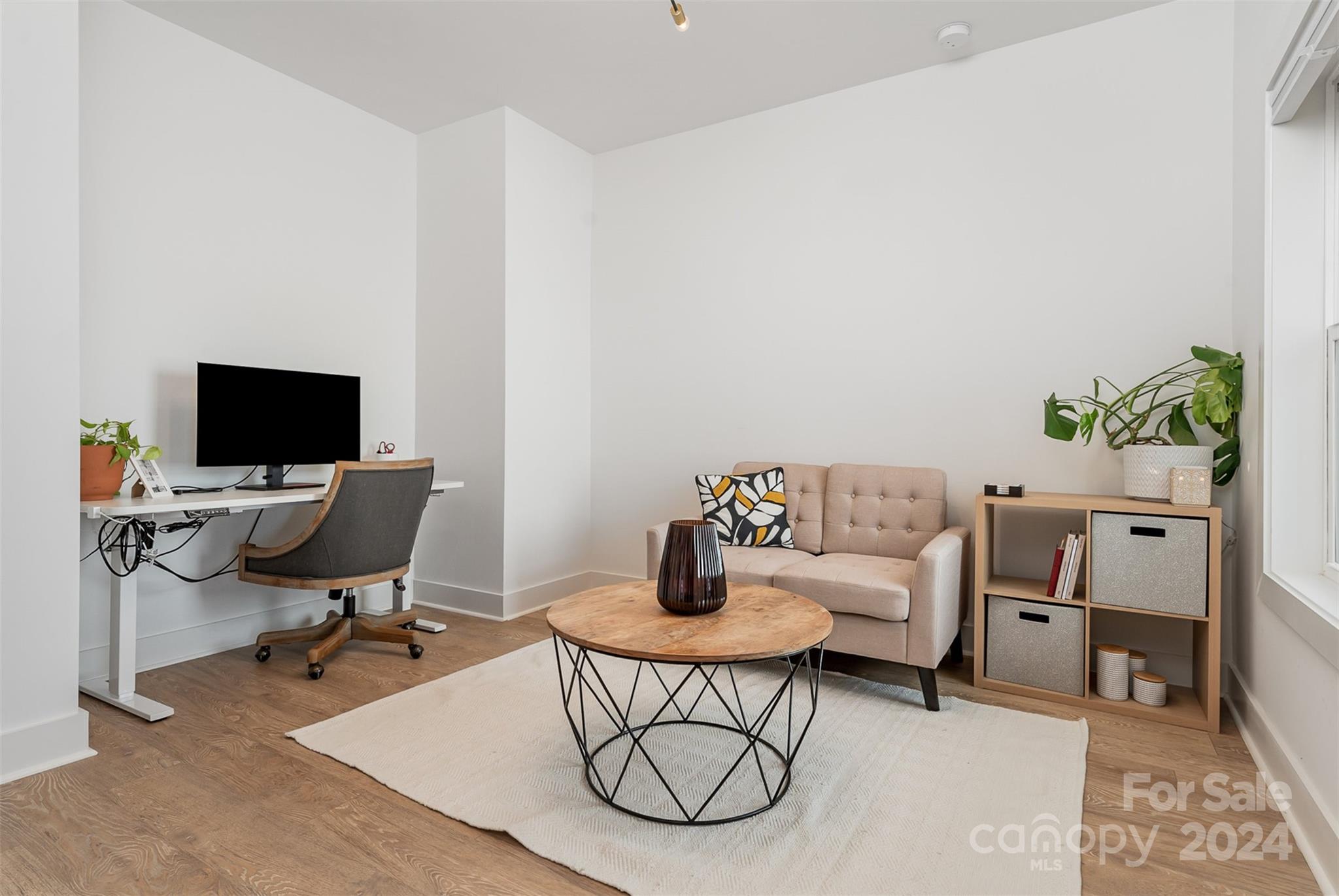 643 Tennyson Drive Charlotte, NC 28208 - Photo 23 of 42 a living room with furniture a flat screen tv and a table