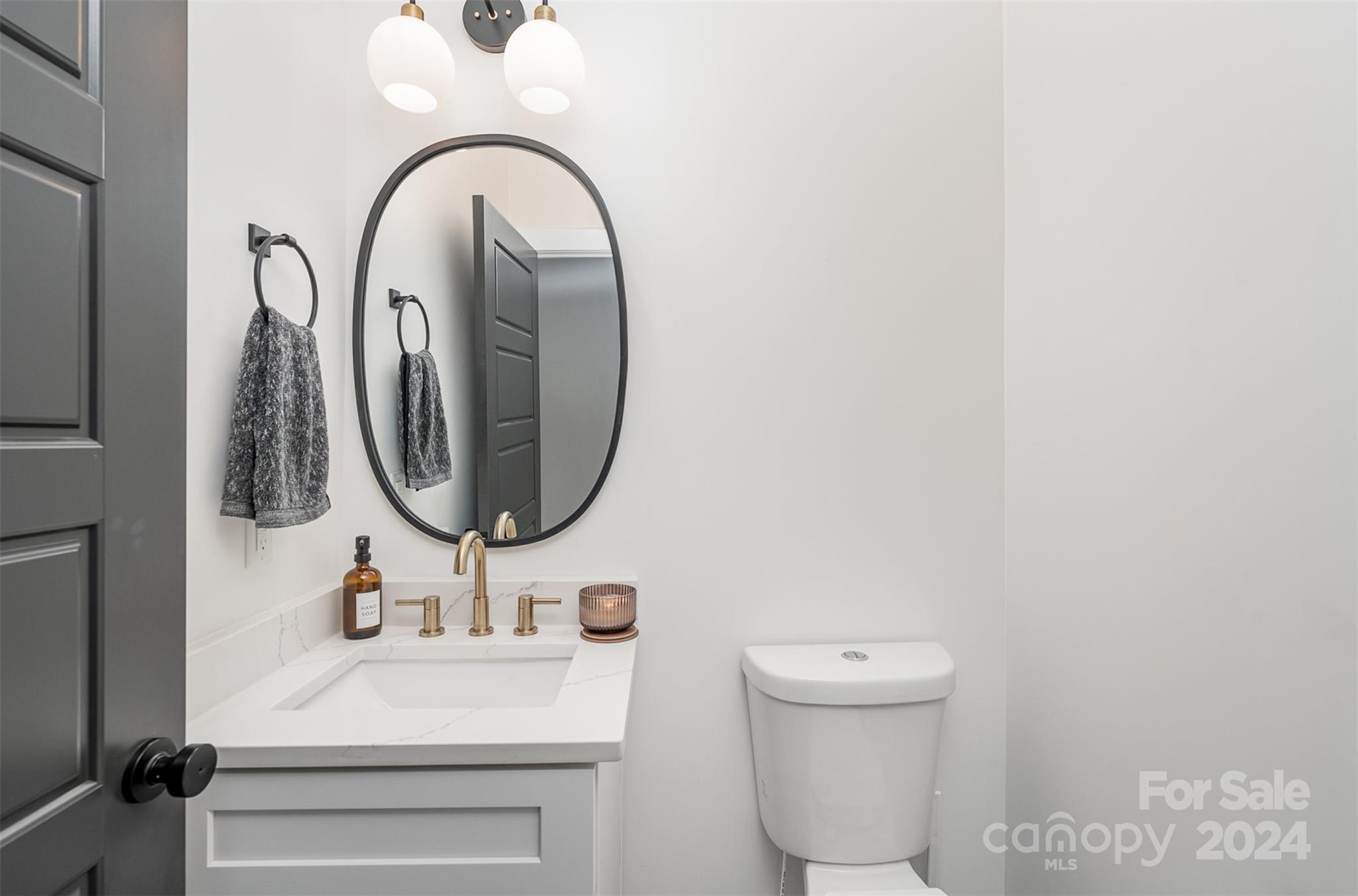 643 Tennyson Drive Charlotte, NC 28208 - Photo 25 of 42 a bathroom with a sink and a mirror