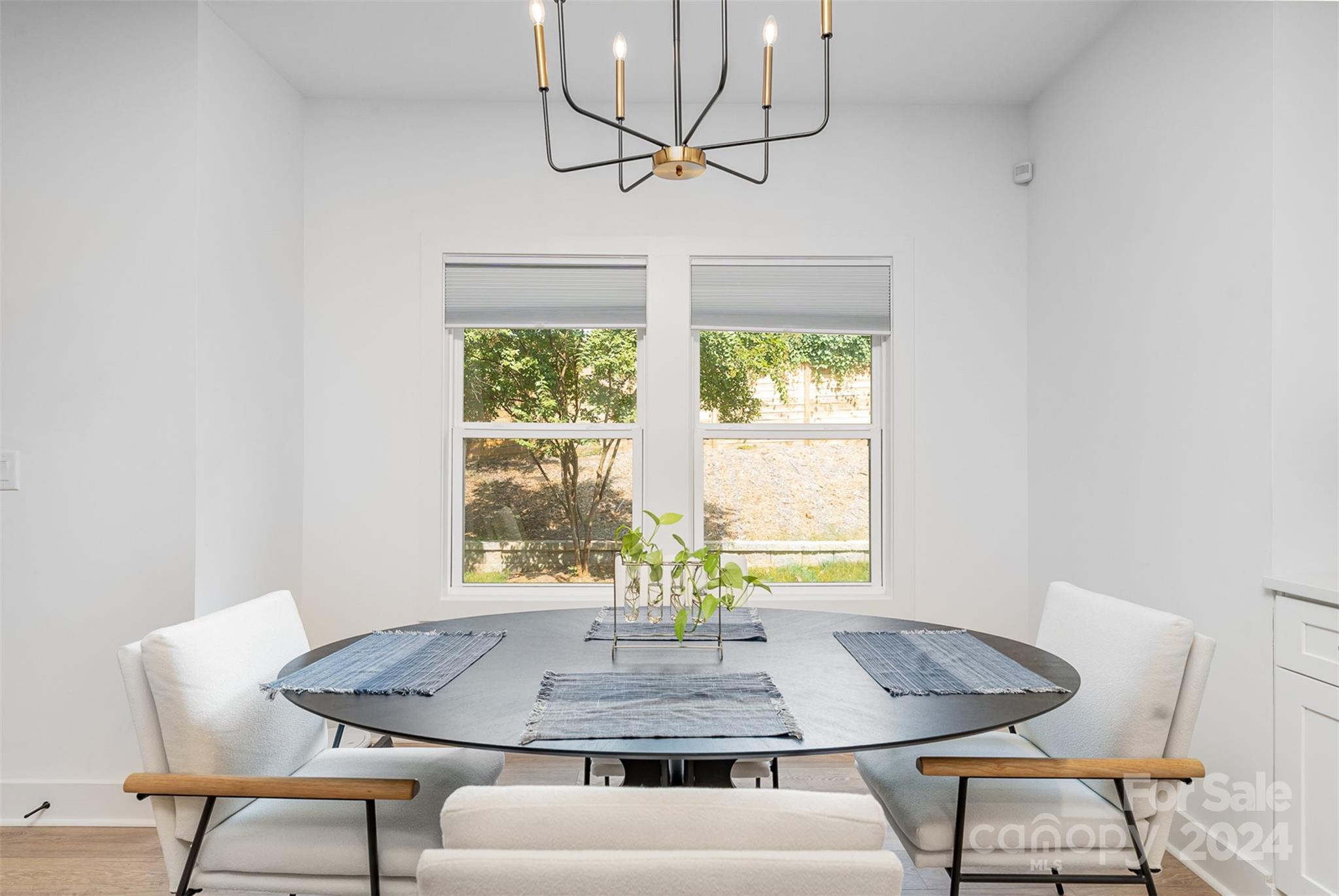 643 Tennyson Drive Charlotte, NC 28208 - Photo 30 of 42 a view of a dining room with furniture and a window