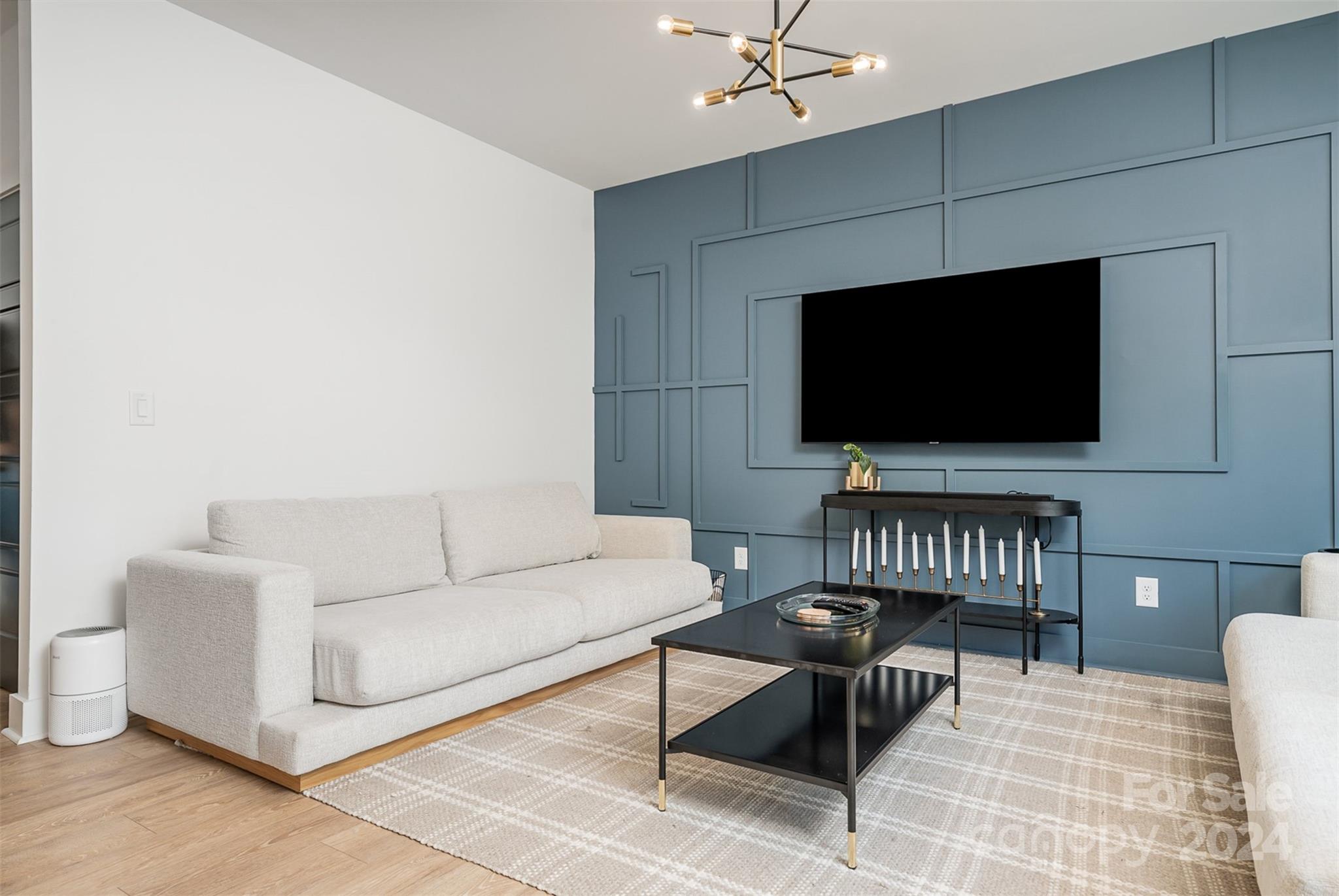 643 Tennyson Drive Charlotte, NC 28208 - Photo 34 of 42 a living room with furniture and a flat screen tv