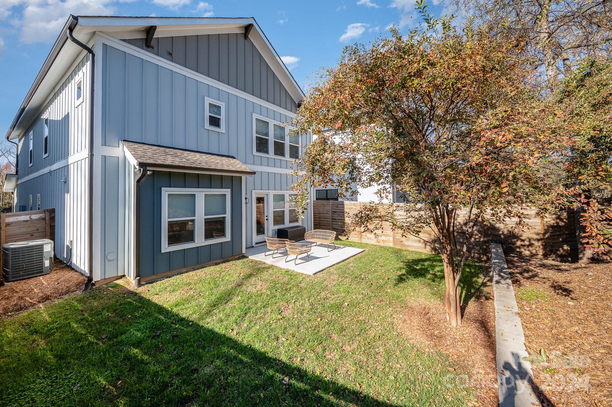 643 Tennyson Drive Charlotte, NC 28208 - Photo 41 of 42 a view of an house with backyard space and balcony