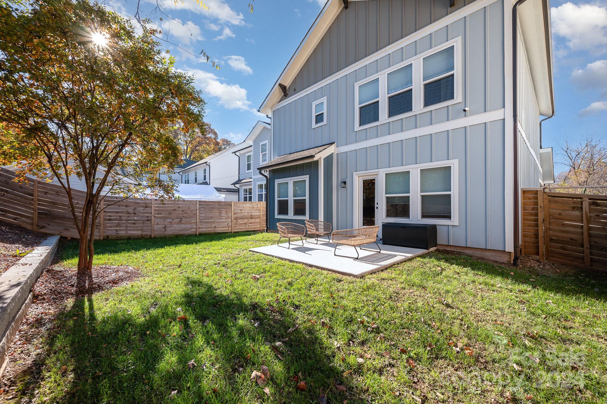643 Tennyson Drive Charlotte, NC 28208 - Photo 42 of 42 a backyard of a house with yard and outdoor seating