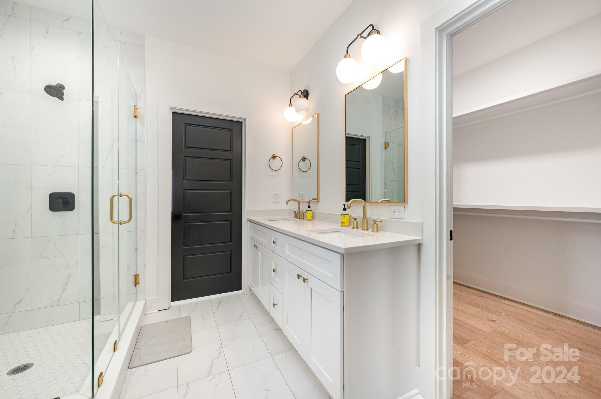 643 Tennyson Drive Charlotte, NC 28208 - Photo 9 of 42 a bathroom with a double vanity sink mirror and shower