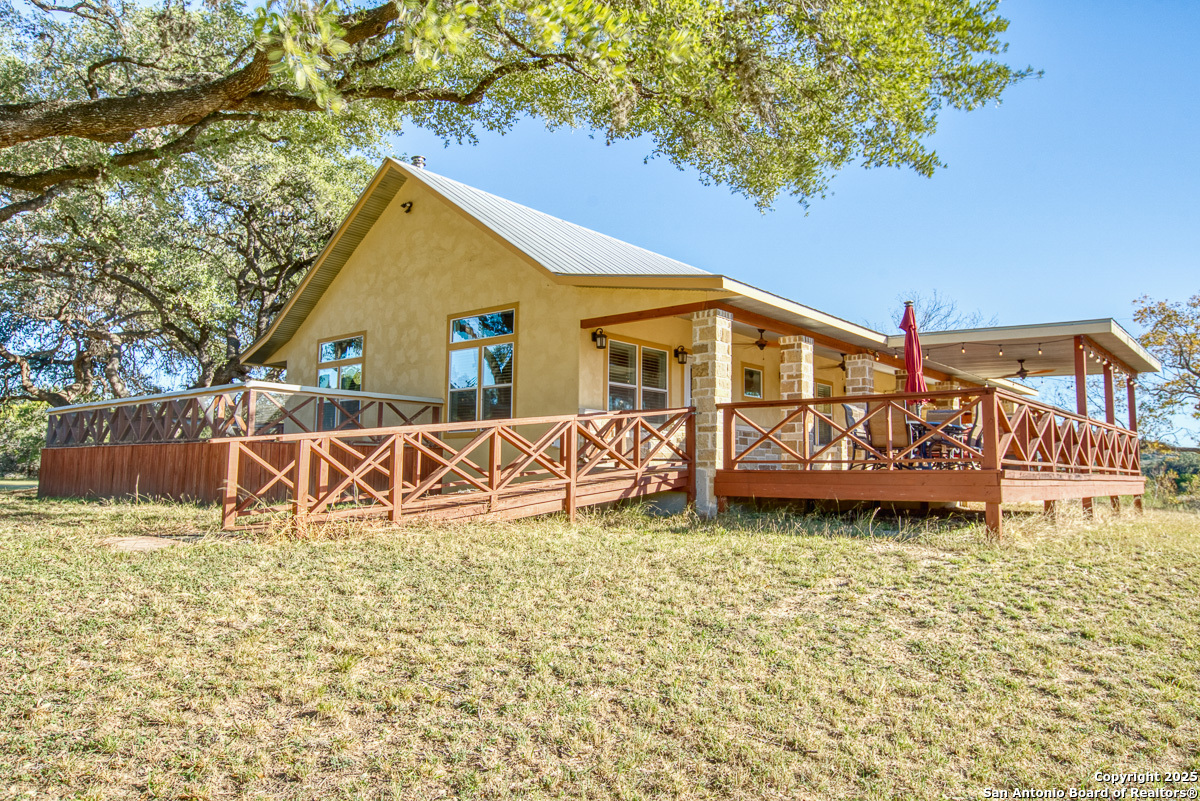 255 North Thunder Creek Road Utopia, TX 78884 - Photo 30 of 46 a house view with a garden space