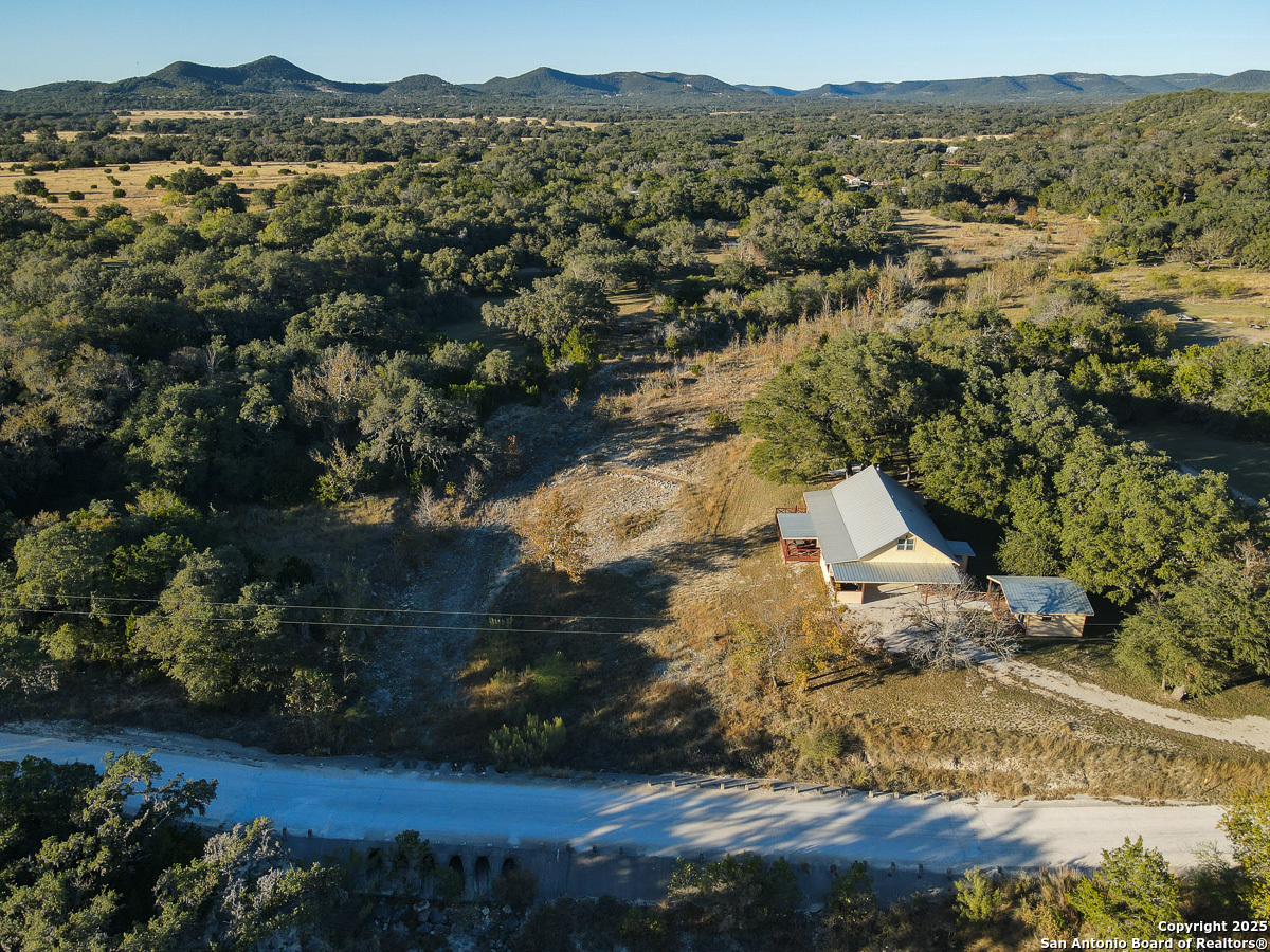 255 North Thunder Creek Road Utopia, TX 78884 - Photo 3 of 46 an aerial view of residential house with outdoor space