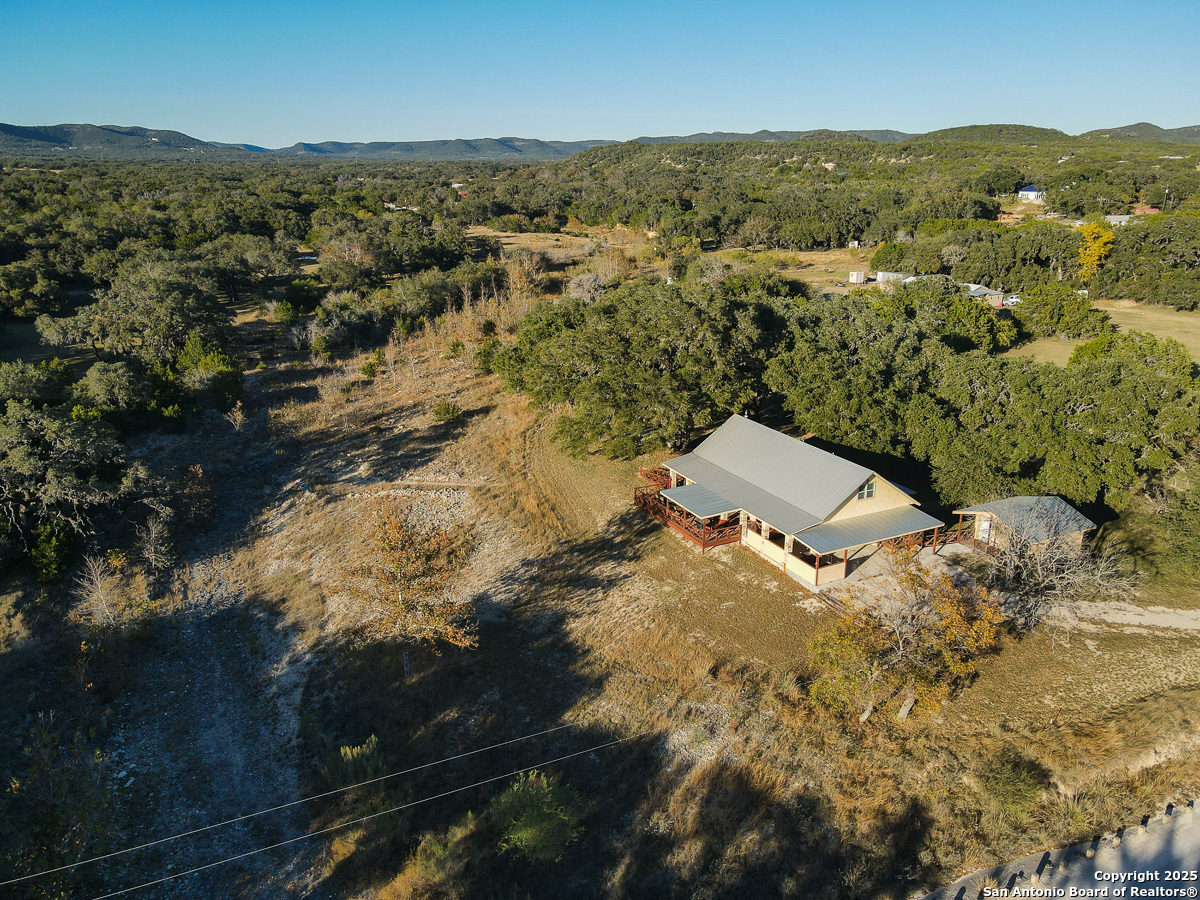 255 North Thunder Creek Road Utopia, TX 78884 - Photo 38 of 46 an aerial view of a house with a yard