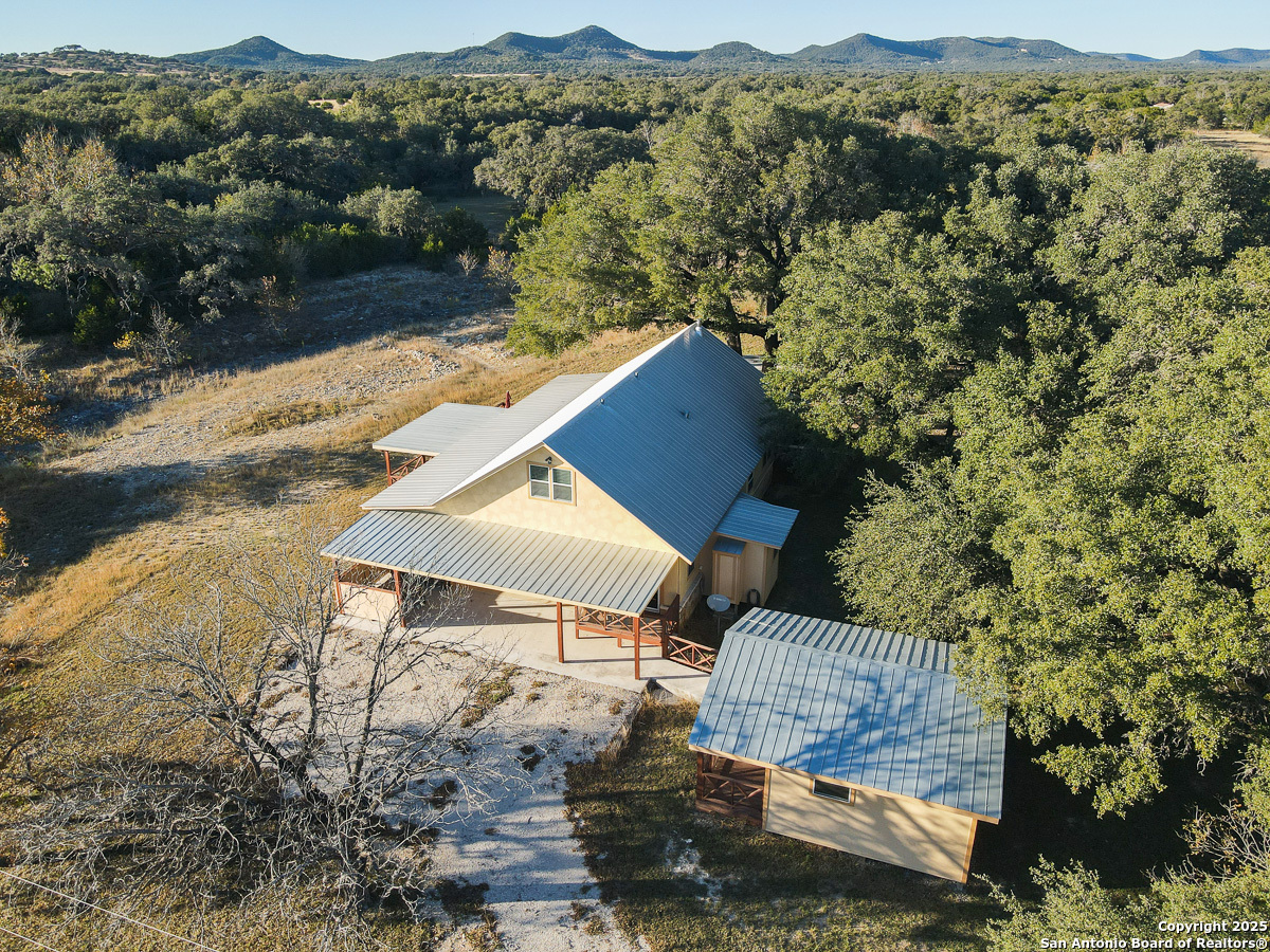 255 North Thunder Creek Road Utopia, TX 78884 - Photo 42 of 46 an aerial view of houses with outdoor space