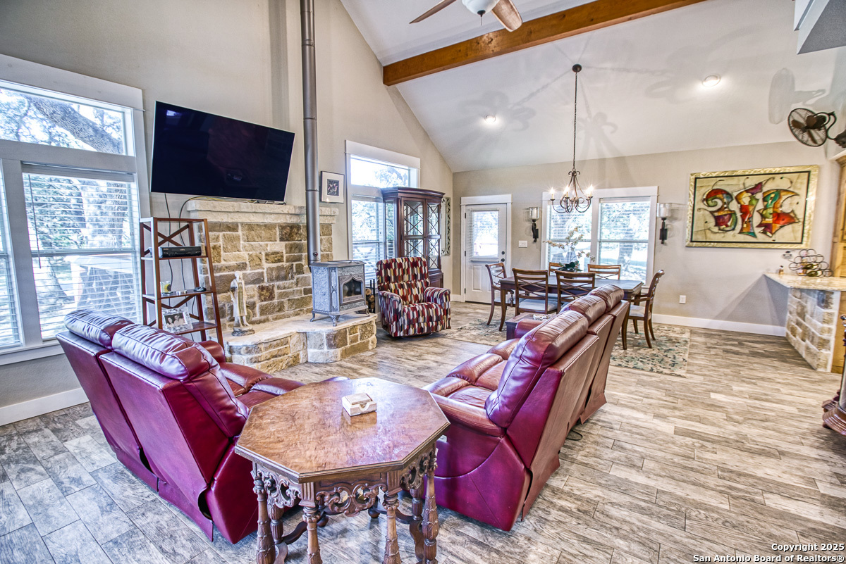 255 North Thunder Creek Road Utopia, TX 78884 - Photo 7 of 46 a living room with fireplace furniture and a flat screen tv