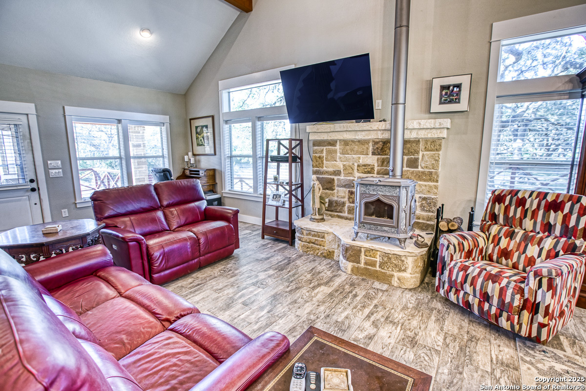 255 North Thunder Creek Road Utopia, TX 78884 - Photo 10 of 46 a living room with furniture fireplace and flat screen tv