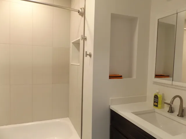 a bathroom with a sink and a bathtub