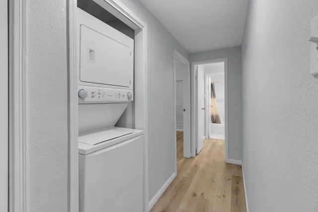 a view of bathroom with a washer and dryer