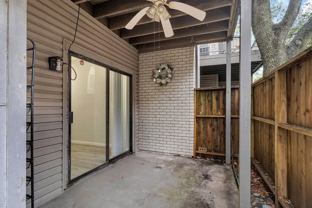 a view of a house with a door and wooden walls