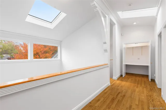 a spacious bedroom with a bed and cabinets