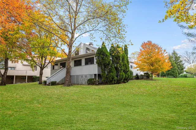 a view of a house with a yard and plants