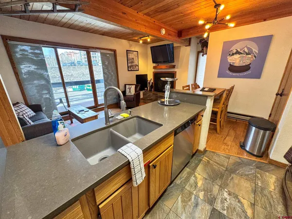 a view of a kitchen with furniture and windows
