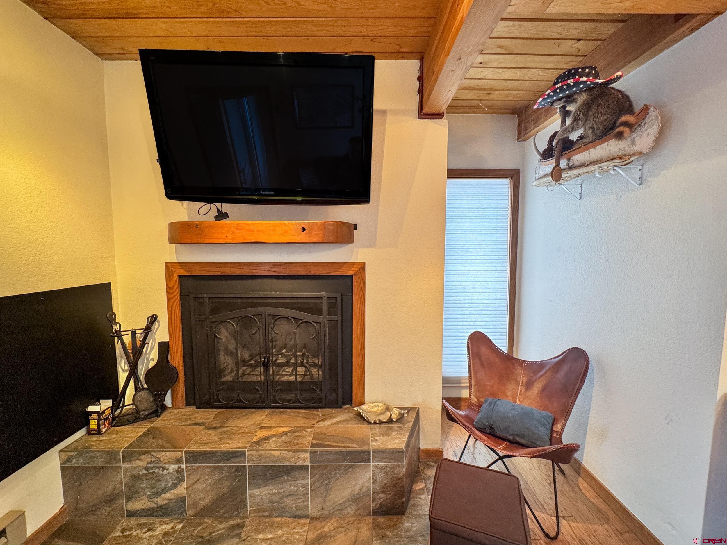 400 Gothic Road, Unit 305 Crested Butte, CO 81225 - Photo 14 of 38 a living room with furniture and a fireplace