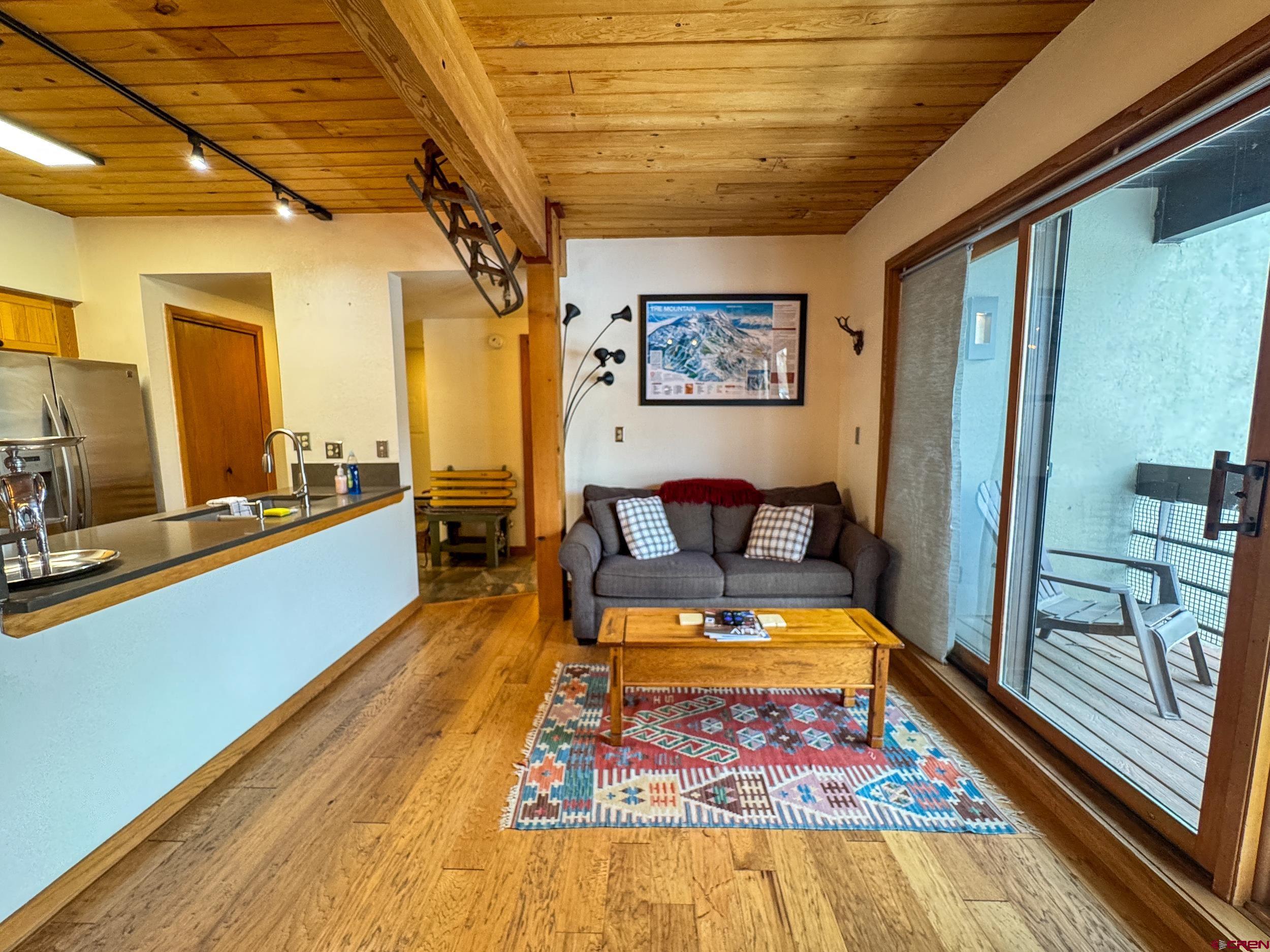 400 Gothic Road, Unit 305 Crested Butte, CO 81225 - Photo 15 of 38 a living room with a rug