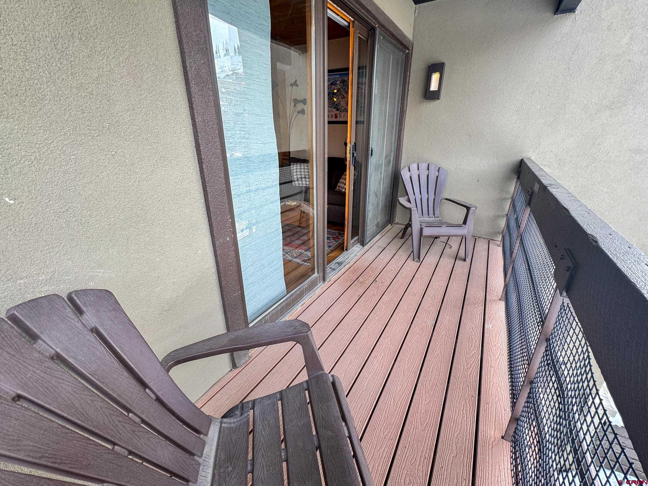 400 Gothic Road, Unit 305 Crested Butte, CO 81225 - Photo 22 of 38 a view of a hallway with wooden floor and stairs