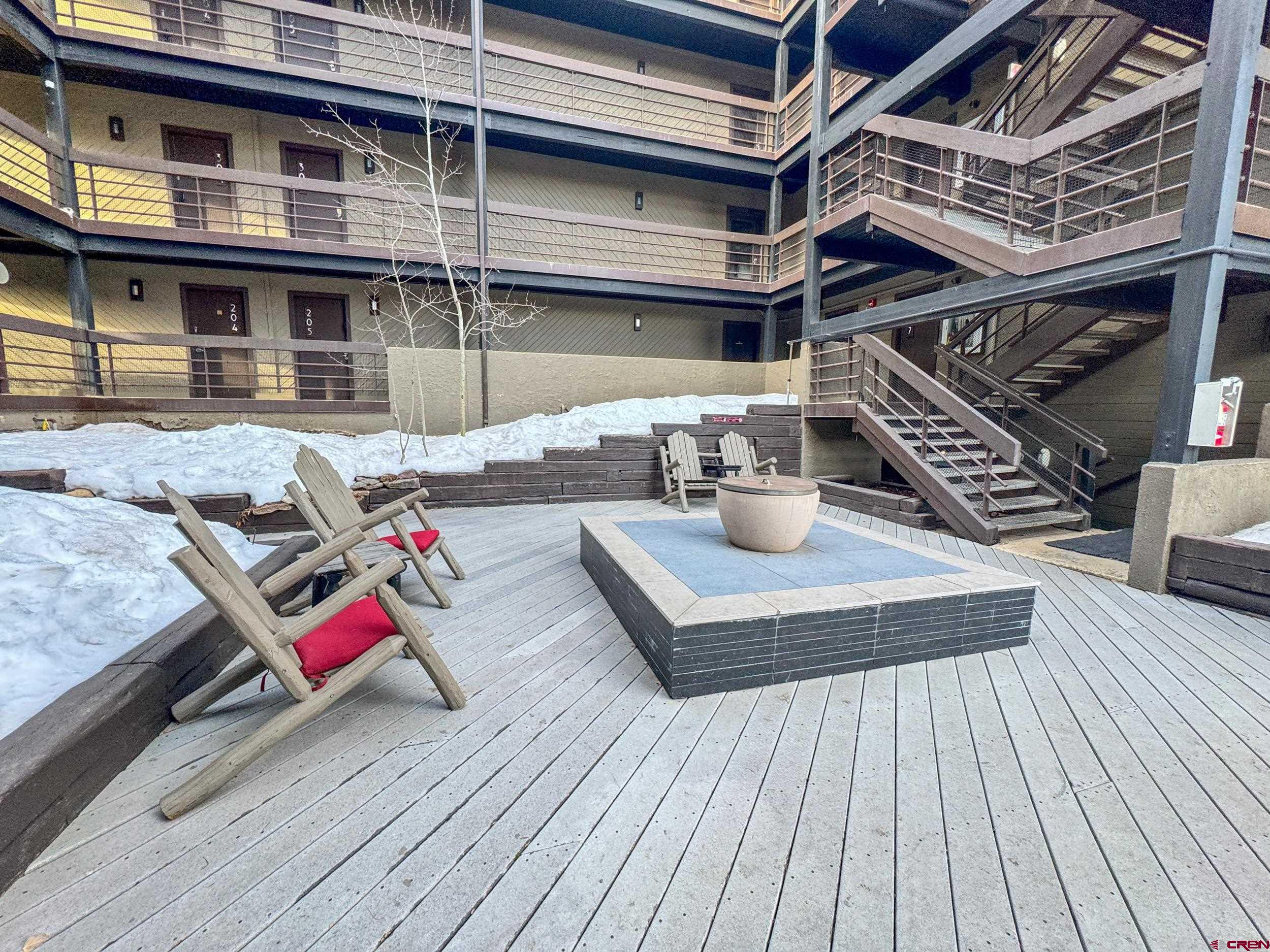 400 Gothic Road, Unit 305 Crested Butte, CO 81225 - Photo 29 of 38 a view of a house with pool and chairs