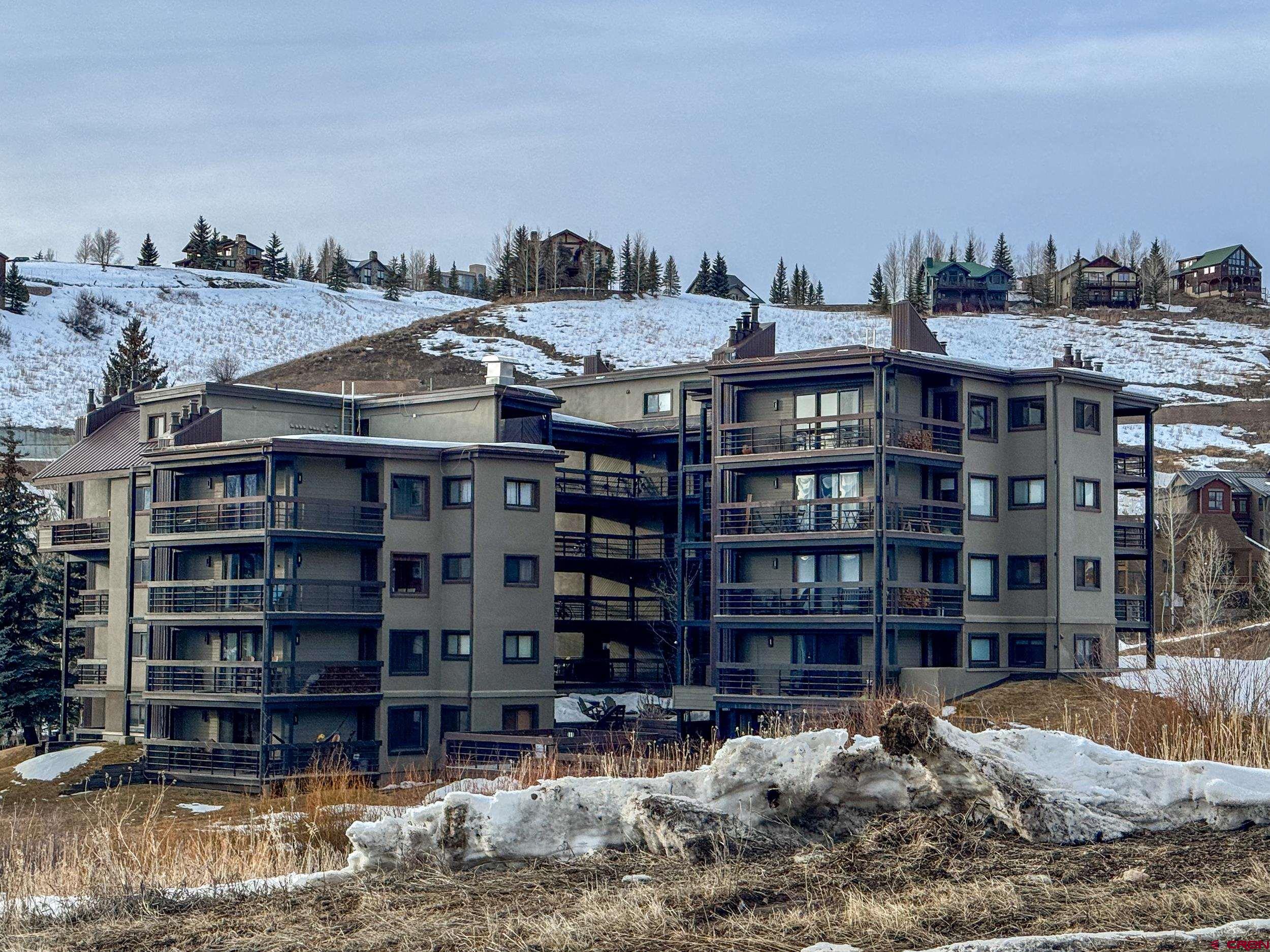 400 Gothic Road, Unit 305 Crested Butte, CO 81225 - Photo 38 of 38 a view of a large building with a water fall