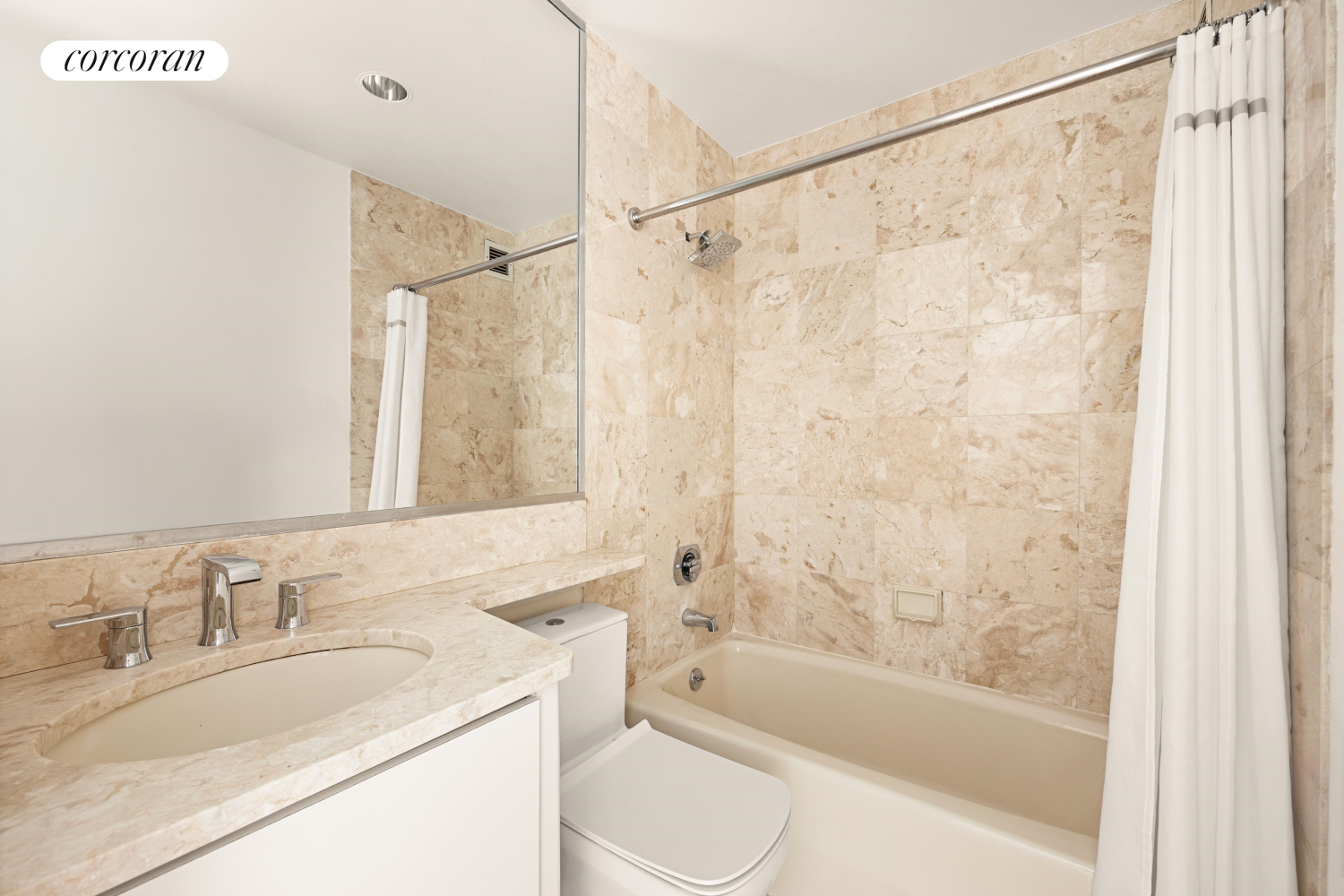 100 United Nations Plaza, Unit 7G Manhattan, NY 10017 - Photo 10 of 12 a bathroom with a granite countertop sink toilet and shower