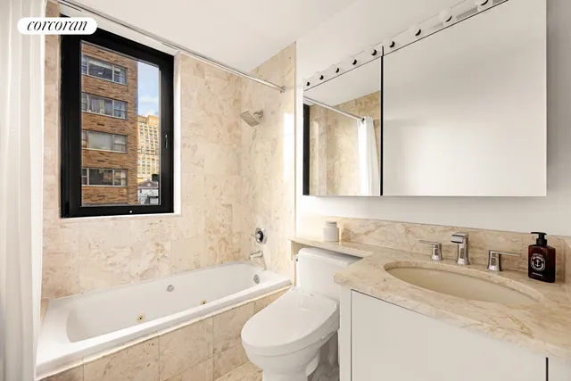 a bedroom with a bed and a shower