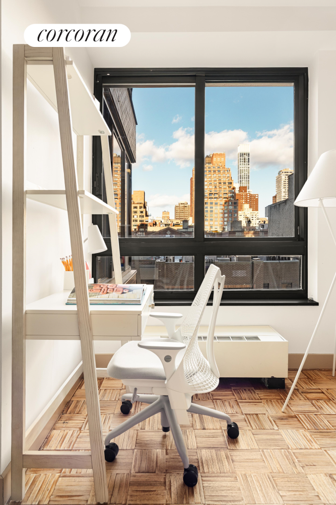 100 United Nations Plaza, Unit 7G Manhattan, NY 10017 - Photo 9 of 12 a view of living room with furniture and floor to ceiling windows
