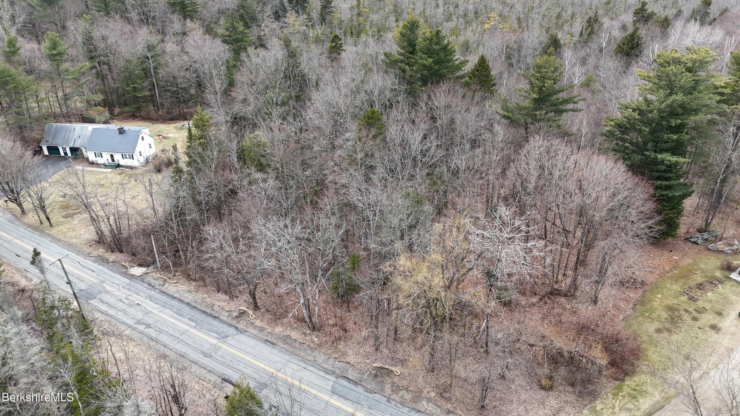 379 New Windsor Road Hinsdale, MA 01235 - Photo 2 of 12 a view of a dry yard with wooden fence