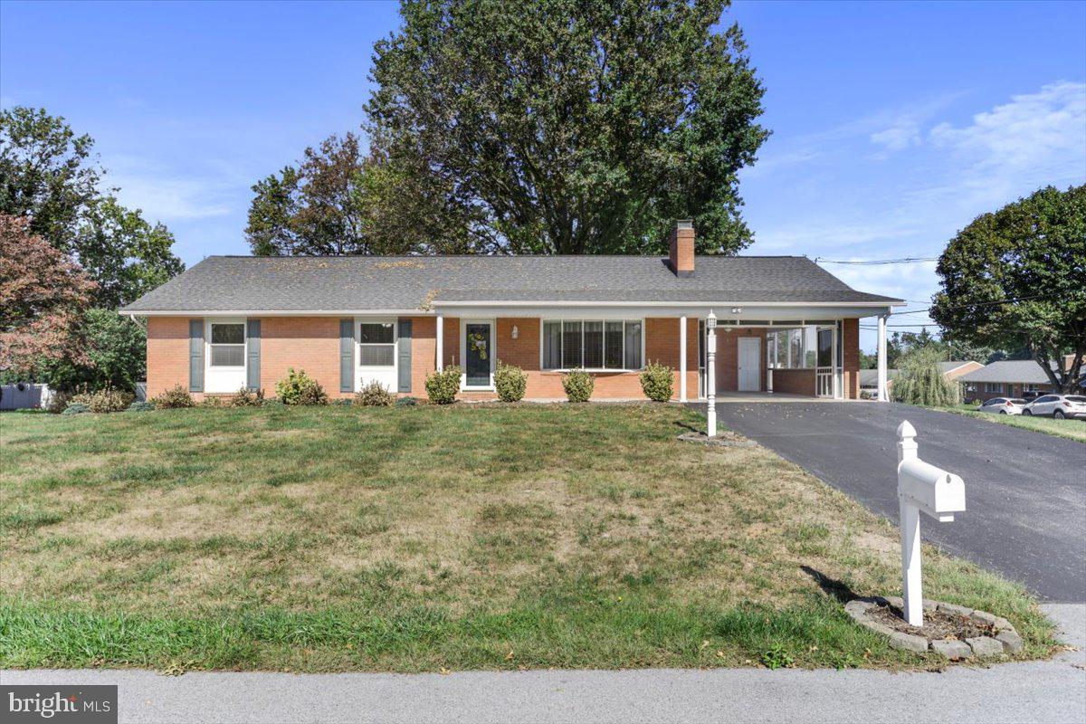 front view of a house next to a yard