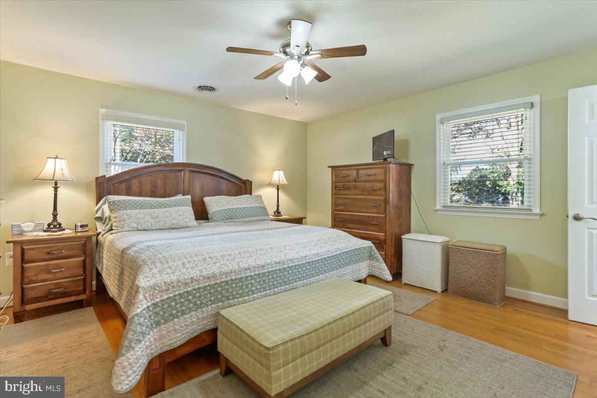 16040 Cloverton Lane Williamsport, MD 21795 - Photo 12 of 35 a bedroom with a bed and dresser with wooden floor