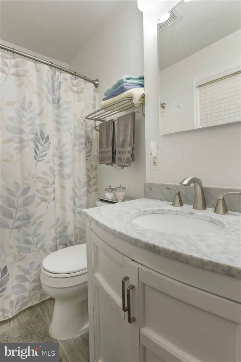 16040 Cloverton Lane Williamsport, MD 21795 - Photo 15 of 35 a bathroom with a granite countertop sink toilet and shower