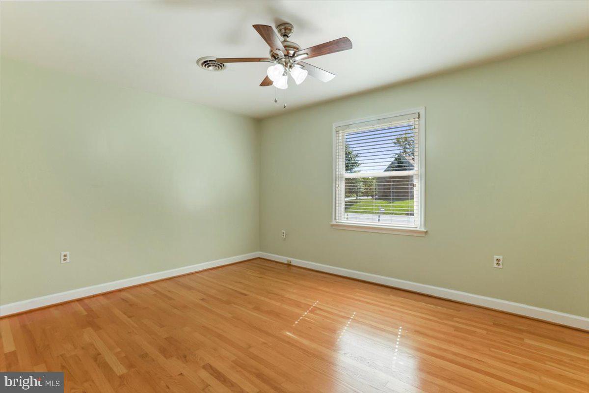 16040 Cloverton Lane Williamsport, MD 21795 - Photo 20 of 35 an empty room with wooden floor and windows
