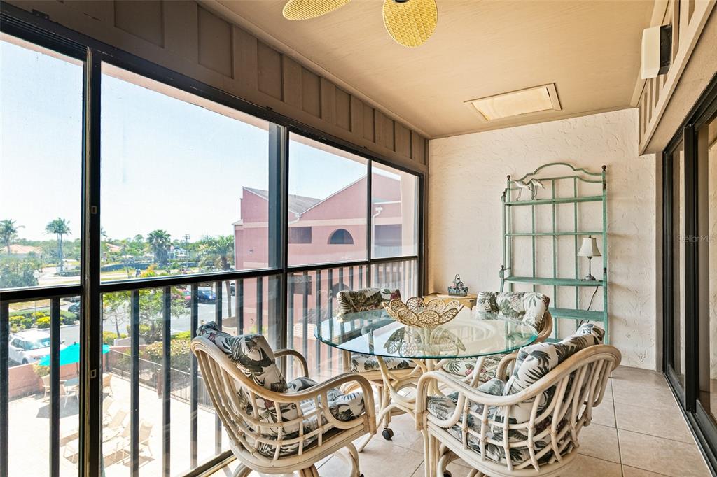 3160 Matecumbe Key Road, Unit 233 Punta Gorda, FL 33955 - Photo 18 of 33 a balcony view with a table and chairs