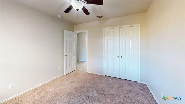 an empty room with a empty space and windows